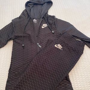 Black Nike bubble jacket with matching pants